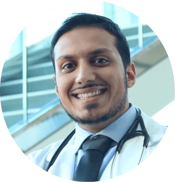 Dr. Furmli wearing a white coat and stethoscope